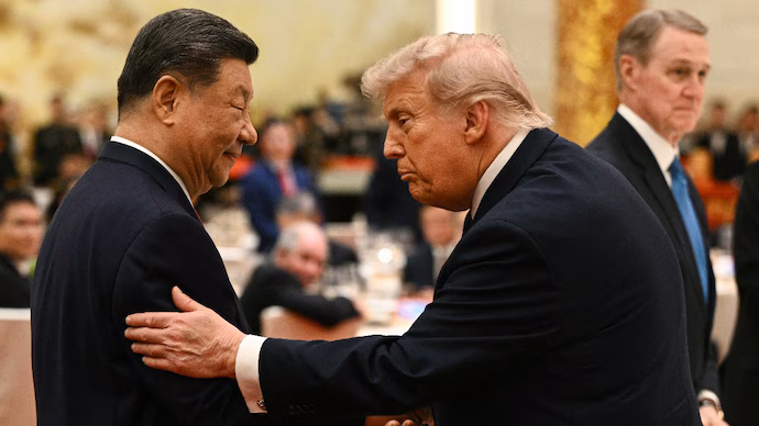 chinas-president-xi-jinping-l-looks-at-us-president-donald-trump-as-they-attend-a-state-banquet-a-142853208-16x9_0